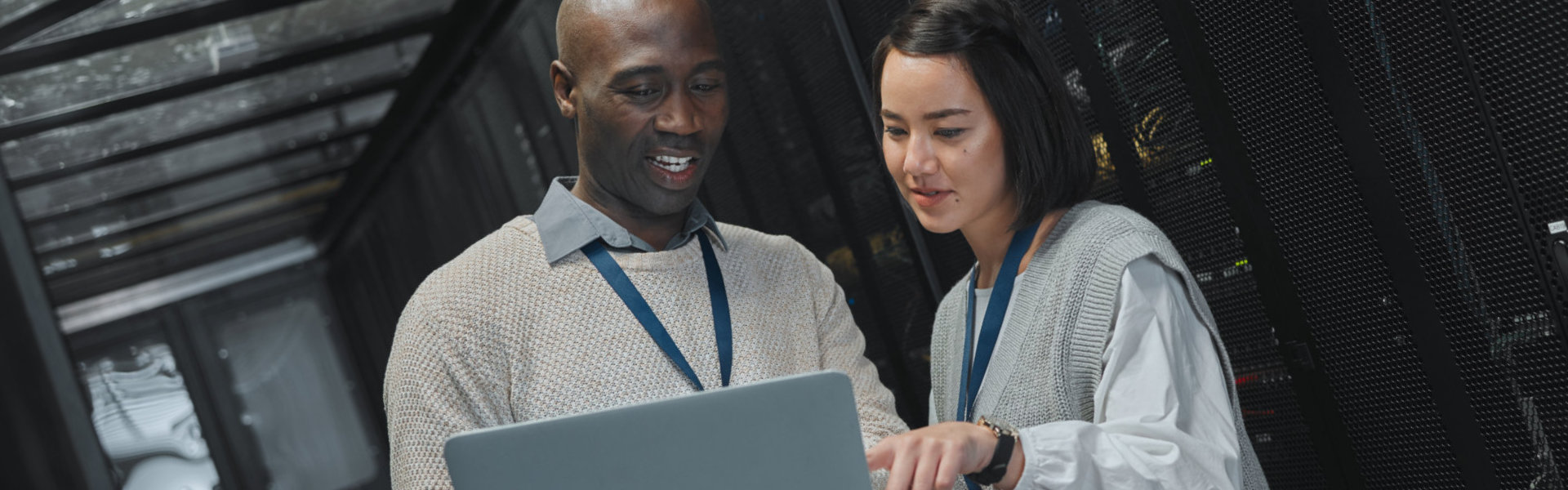 two person looking at the laptop